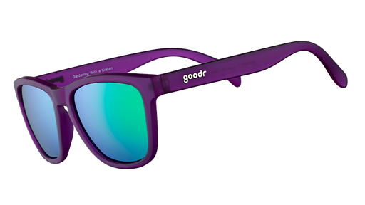 Three-quarter angle view of square-shaped sunglasses with purple frames and reflective green polarized lenses.
